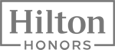 The image shows the Hilton Honors logo with the words "Hilton Honors" framed by lines above and below.