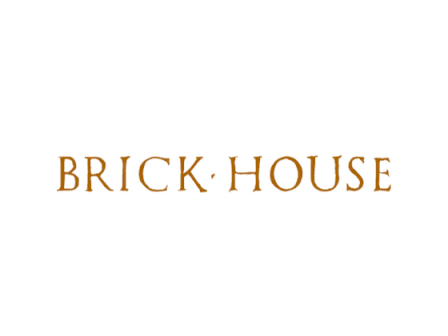 The image shows the text "BRICK HOUSE" in uppercase, using a serif font and brown color, with a centered dot between the words.