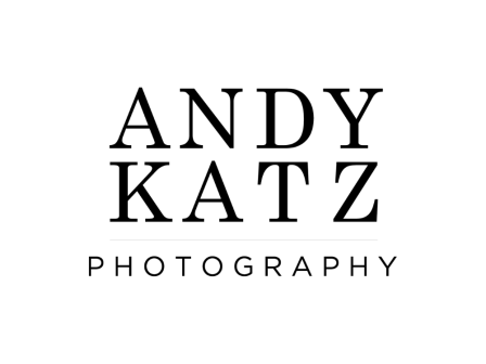 The image displays the text "Andy Katz Photography" in black capital letters on a white background, indicating a photography brand or service.