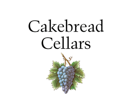 Cakebread Cellars logo with a bunch of blue grapes and green leaves beneath the text, giving a vintage winery look.
