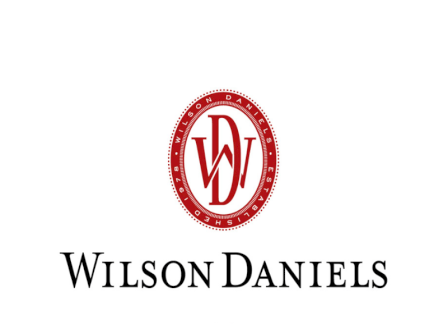 A red-and-white circular &ldquo;W/D&rdquo; logo above the text &ldquo;Wilson Daniels,&rdquo; likely showing the company&rsquo;s brand identity.
